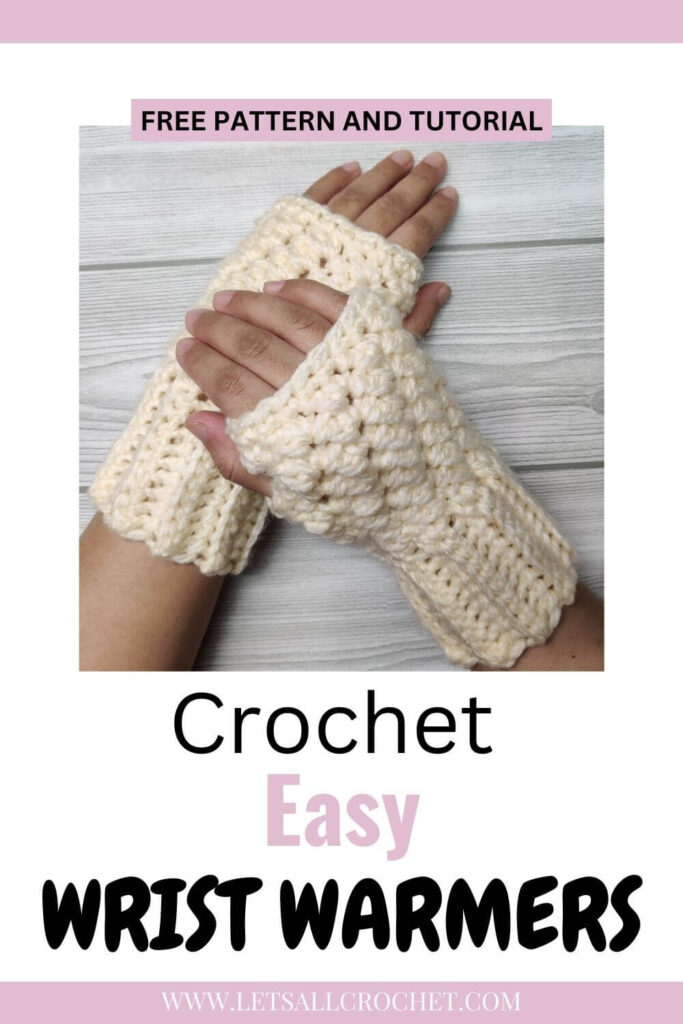 Aki is wearing Cream/ white textured crochet wrist warmer with a grey striped wallpaper and the text overlay reads crochet easy wrist warmers.