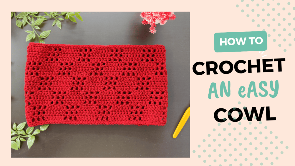 a picture of a red cowl lying on a black table with flowers in the background along with the text how to crochet an easy cowl